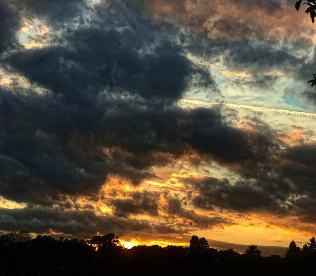 Low angle view of dramatic sky during sunset