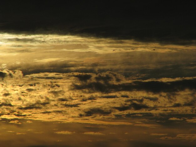 Low angle view of dramatic sky during sunset