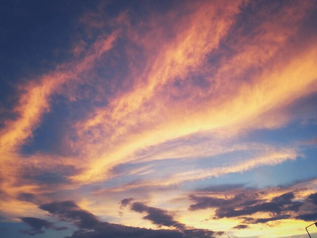 Low angle view of dramatic sky during sunset