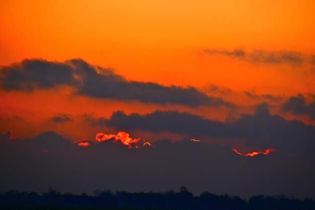 Low angle view of dramatic sky during sunset