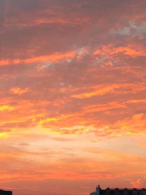 Low angle view of dramatic sky during sunset