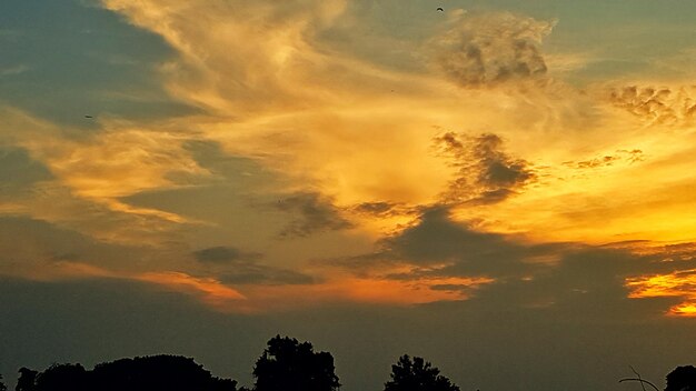 Low angle view of dramatic sky during sunset