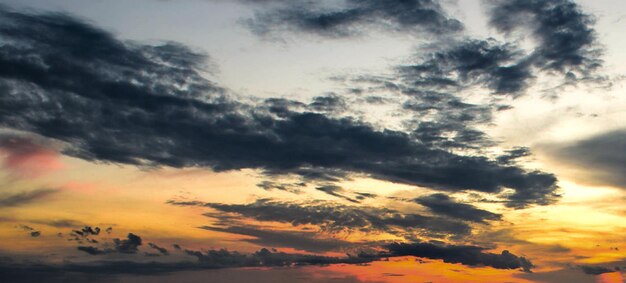 Low angle view of dramatic sky during sunset