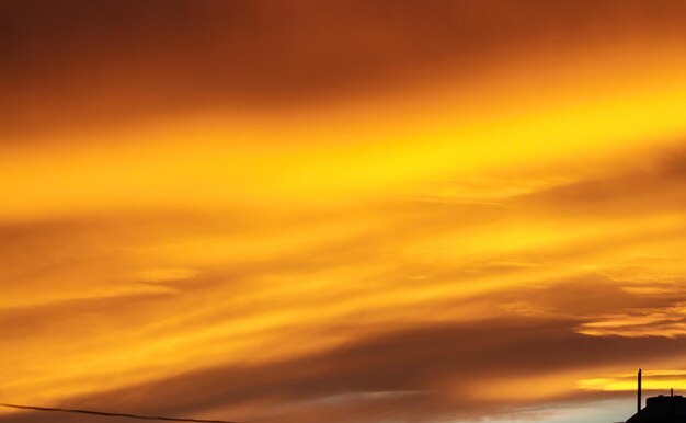 Low angle view of dramatic sky during sunset