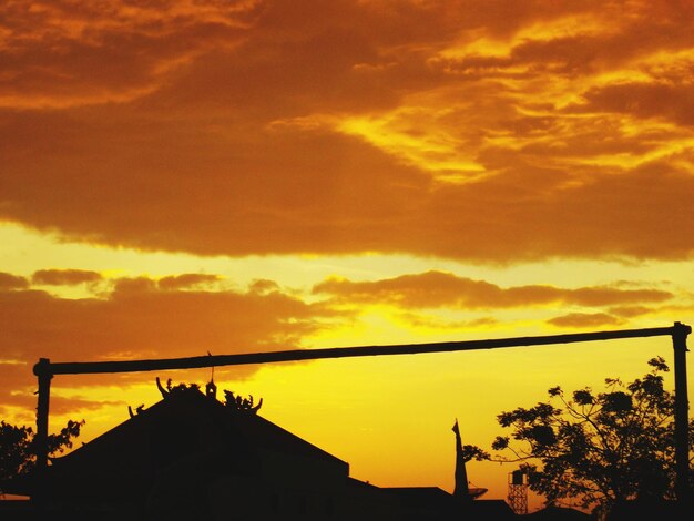 Low angle view of dramatic sky during sunset