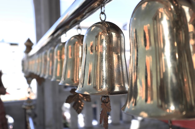 Low angle view of electric lamp hanging in row