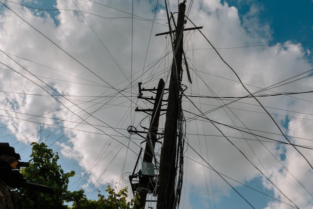 Low angle view of electricity pylon against sky