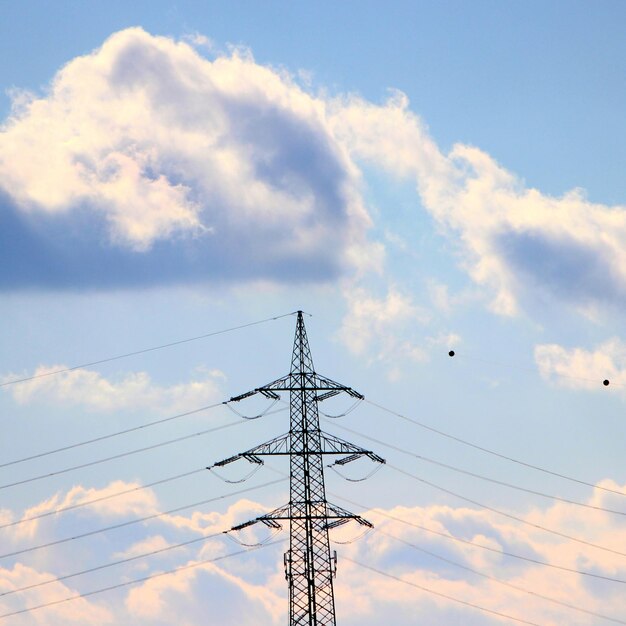 Low angle view of electricity pylon against sky