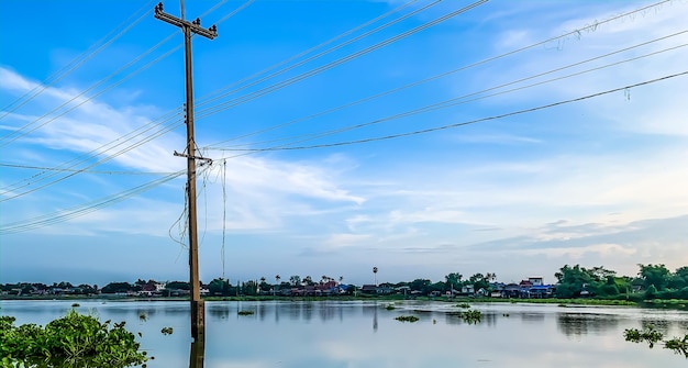 Low angle view of electricity pylon against sky