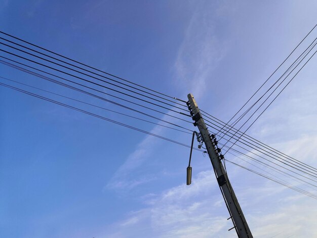 Low angle view of electricity pylon against sky