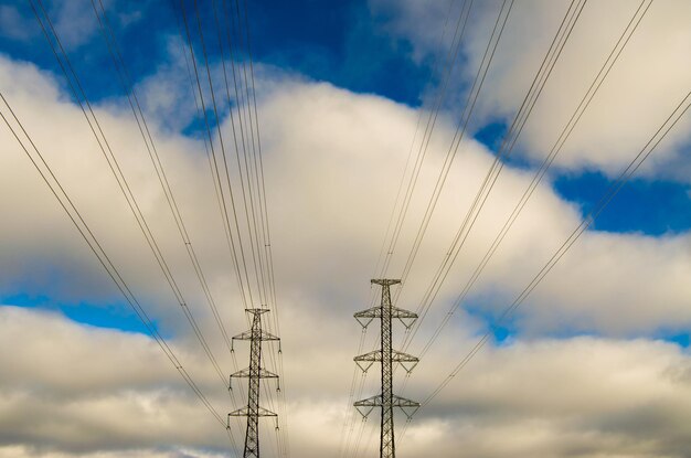 Low angle view of electricity pylon against sky