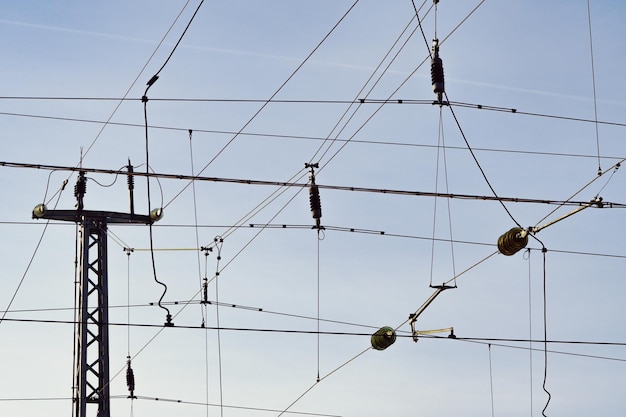 Low angle view of electricity pylon against sky