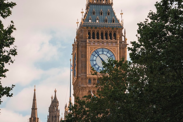 Low angle view of famous big ben at westminster with cloudy sky in background
