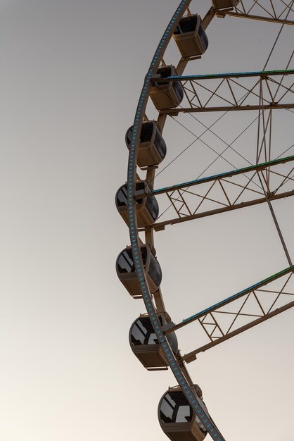 Low angle view of ferris wheel against clear sky