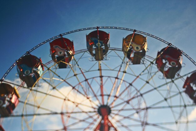 Low angle view of ferris wheel against clear sky