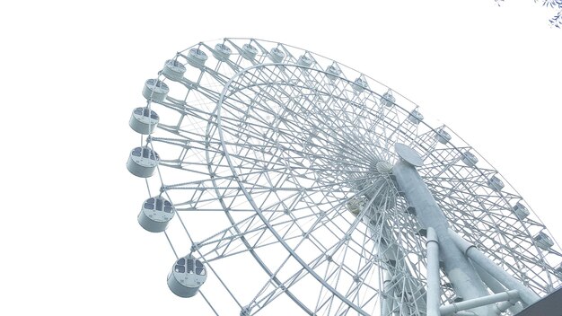 Photo low angle view of ferris wheel against clear sky