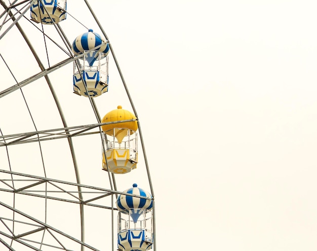 Low angle view of ferris wheel against clear sky