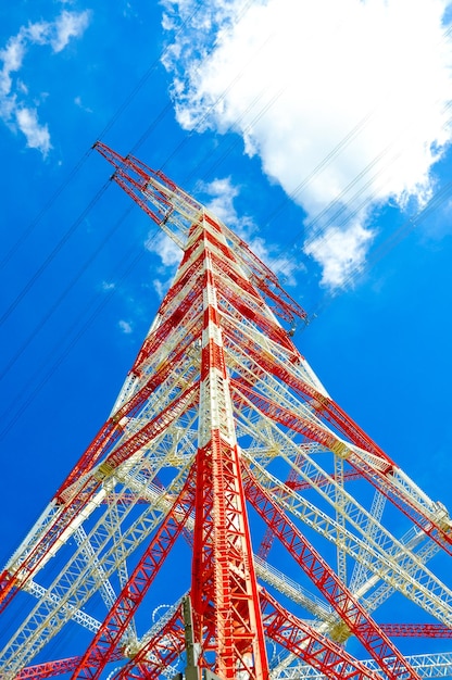 Low angle view of ferris wheel against cloudy sky