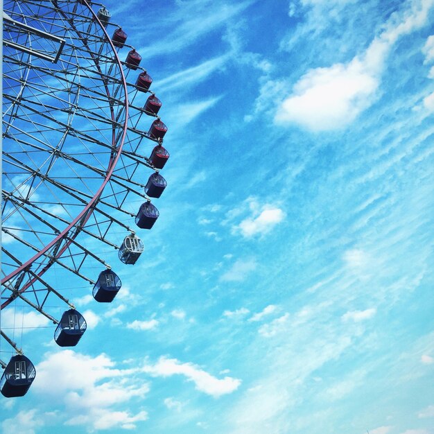 Low angle view of ferris wheel against sky