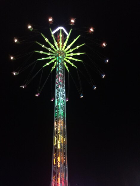 Low angle view of ferris wheel against sky