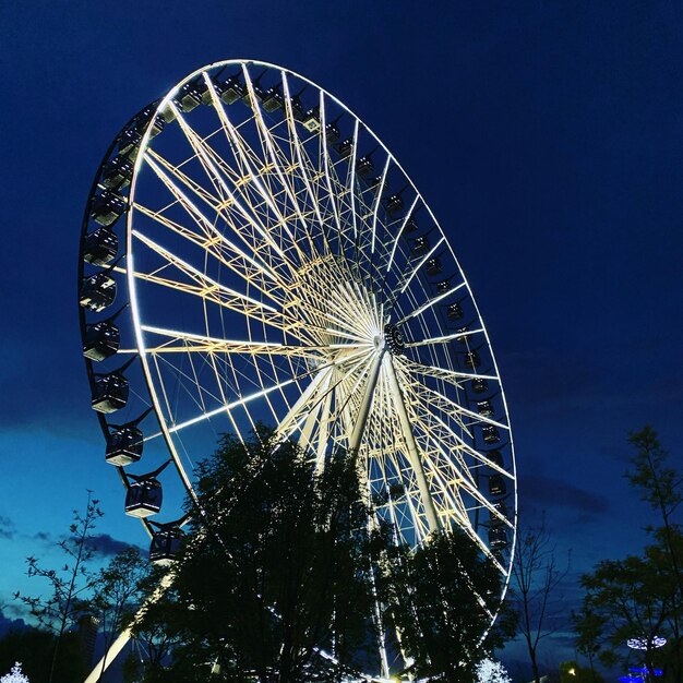 Low angle view of ferris wheel against sky