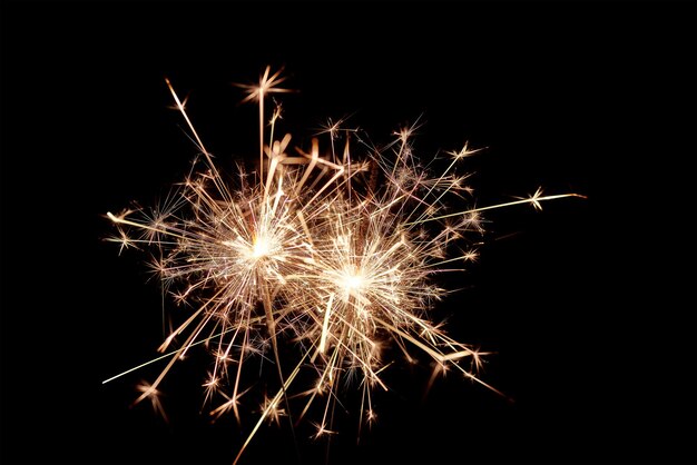 Photo low angle view of firework display against sky at night