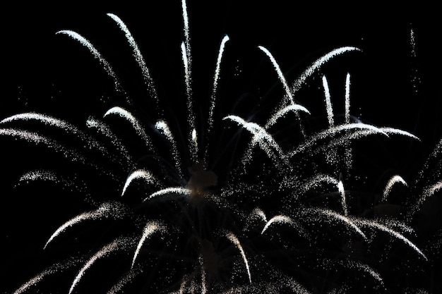 Photo low angle view of firework display against sky at night