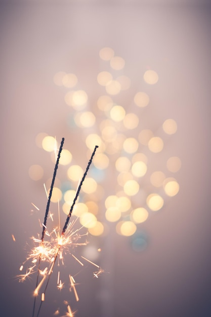 Low angle view of firework display against sky at night