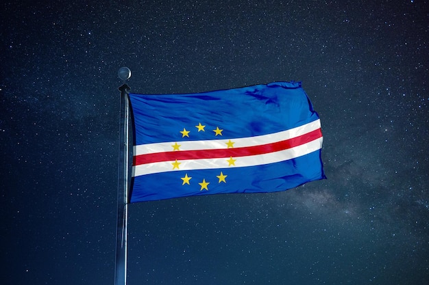 Low angle view of flag against blue sky