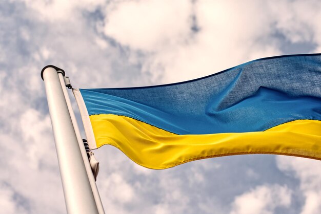 Low angle view of flag against sky