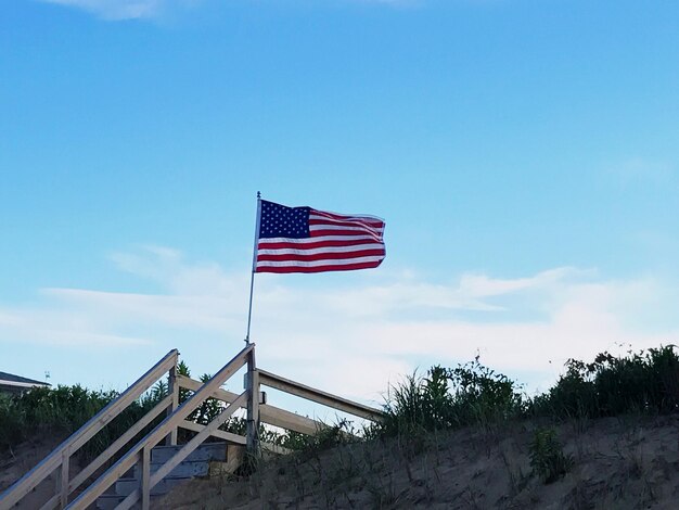 Low angle view of flag against sky