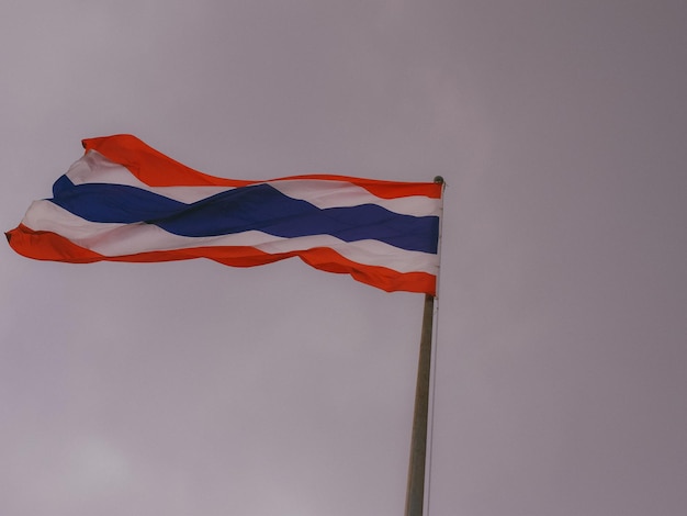 Low angle view of flag against sky