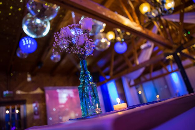 Photo low angle view of flowers in vase on table during christmas