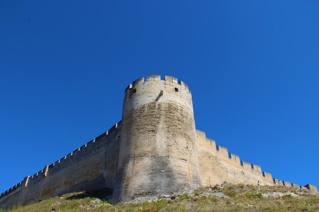 Low angle view of fort against blue sky