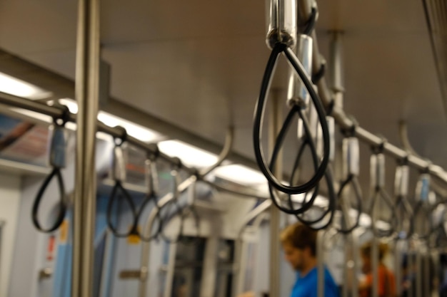 Low angle view of handles in train