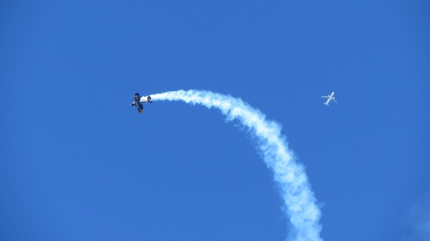 Low angle view of helicopter flying in sky