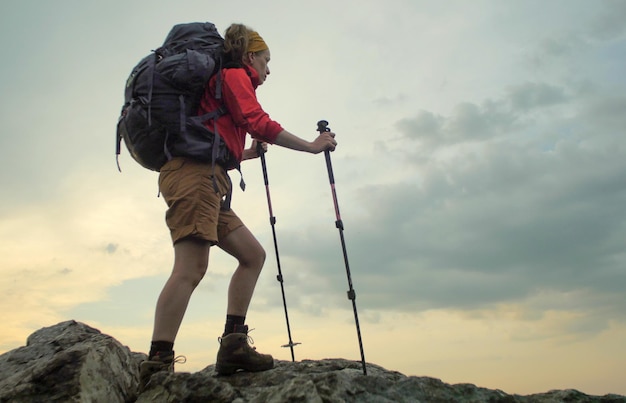 low angle view of hiker on rocky mountain