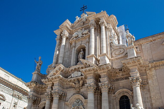 Low angle view of historic building against blue sky