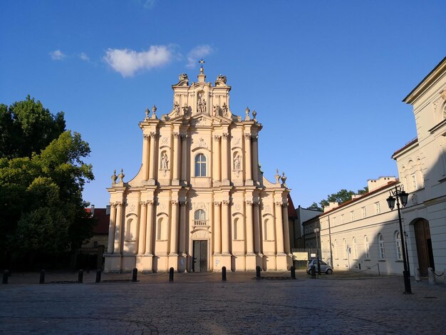 Low angle view of historic building against blue sky