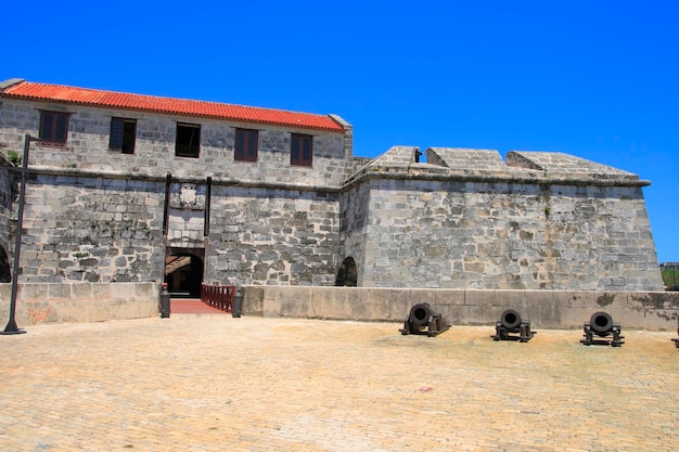 Low angle view of historic building against blue sky