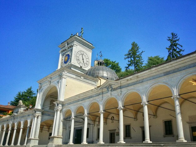 Low angle view of historic building against clear blue sky in city