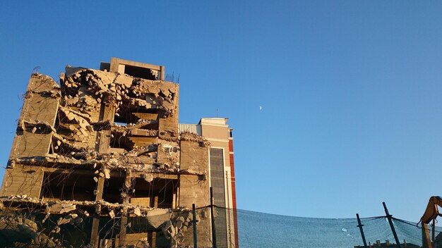 Low angle view of historic building against clear blue sky