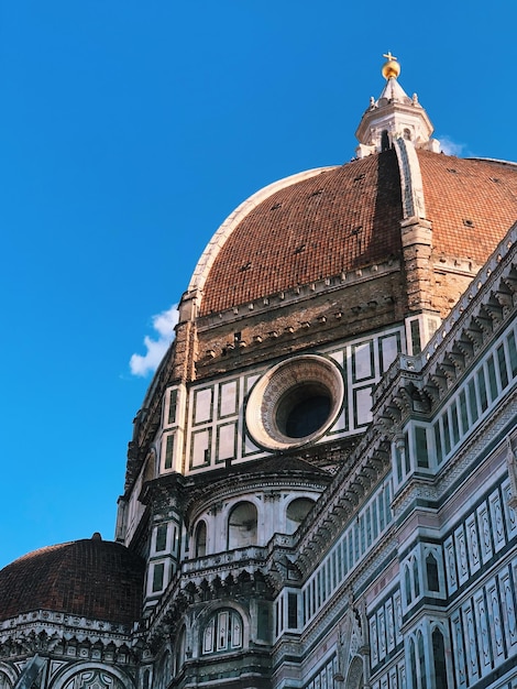 Low angle view of historic building against clear blue sky