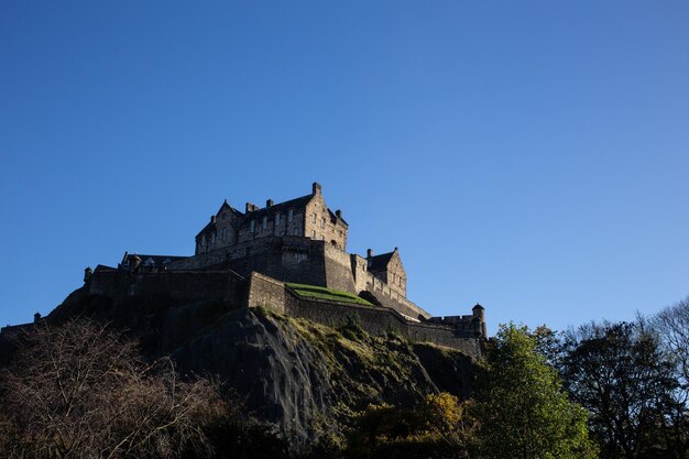 Low angle view of historic building against clear blue sky