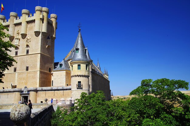 Low angle view of historic building against clear blue sky