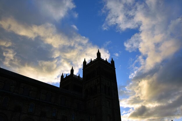 Low angle view of historic durham cathedral against sky