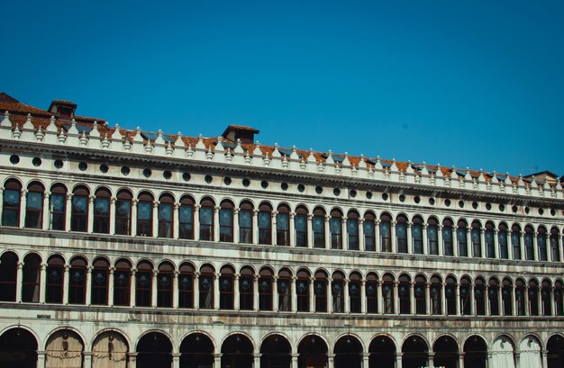 Low angle view of historical building against blue sky