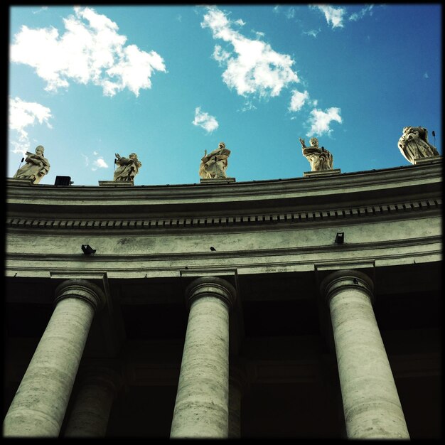 Low angle view of historical building against blue sky