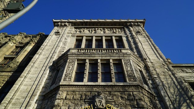 Low angle view of historical building against blue sky