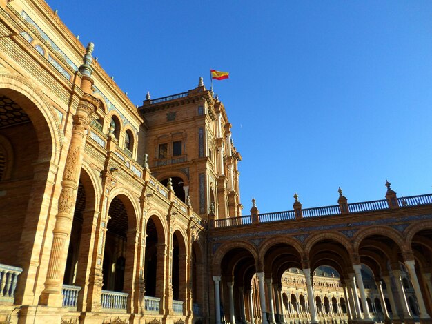 Low angle view of historical building against blue sky